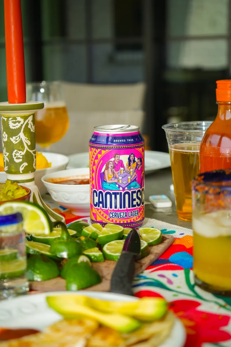 A table of cans, glasses and citrus